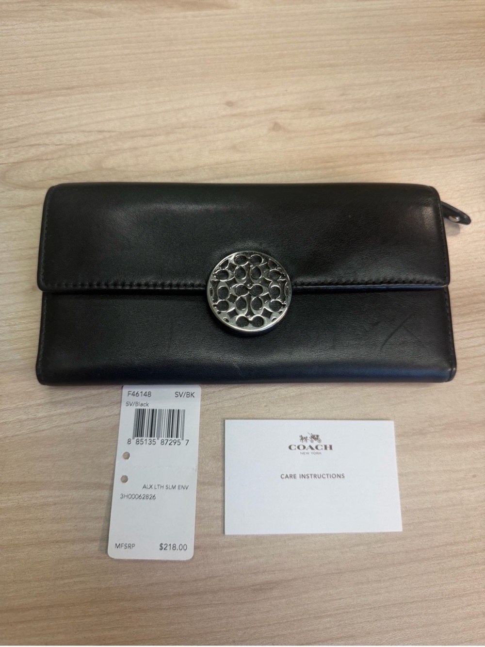 Coach Black Leather Continental Wallet with Silver-Tone Signature Medallion